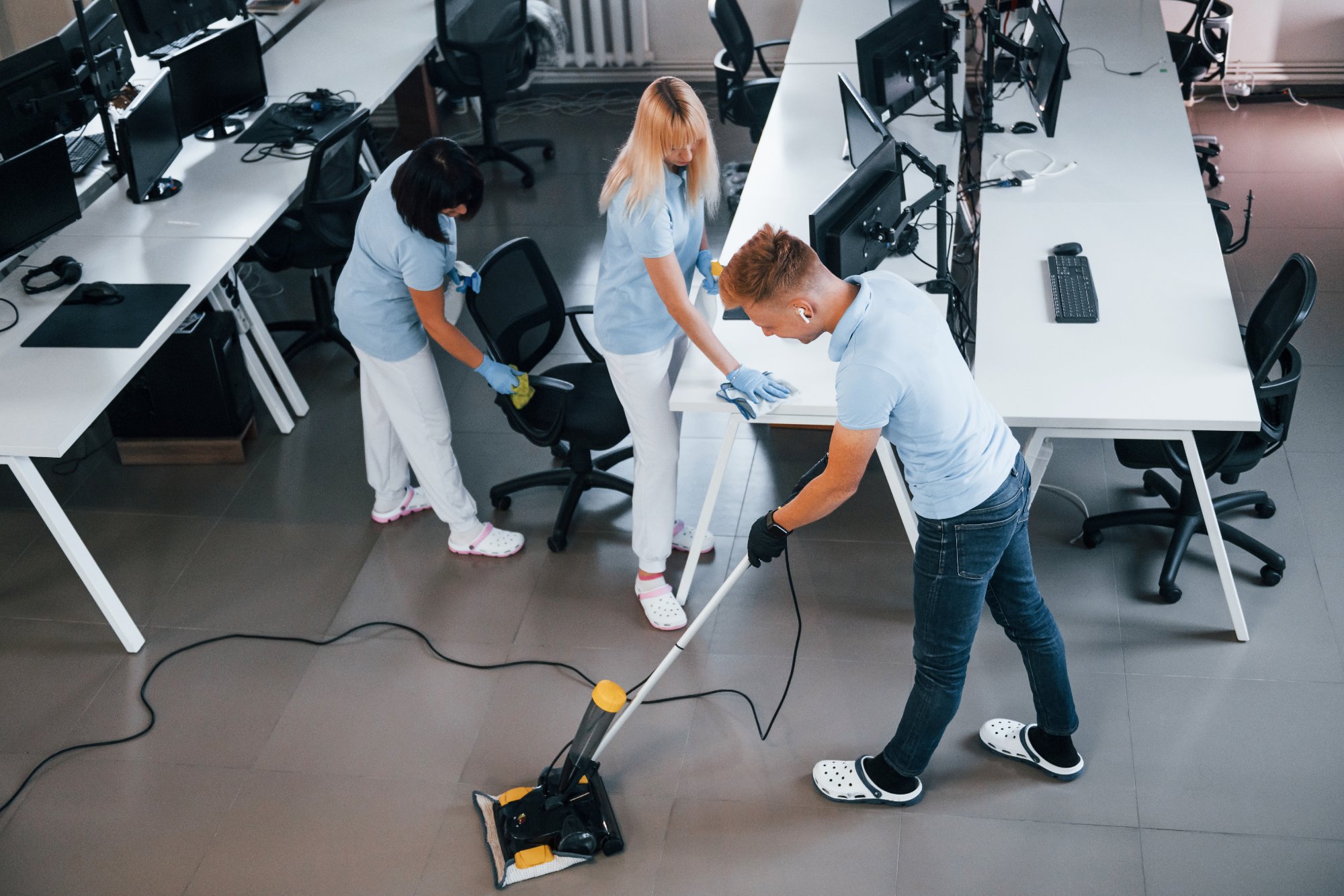 Professional cleaning team working in a modern commercial office